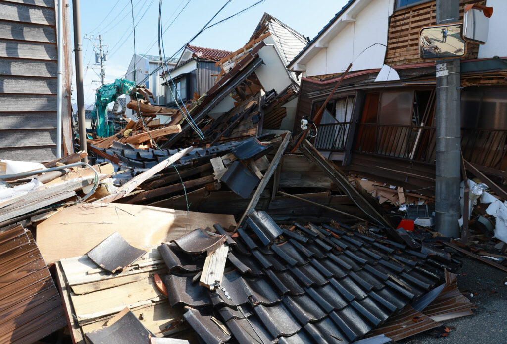 The 7.6-magnitude temblor in central Japan put a lot of stress on the soil, causing it to behave like liquid in some areas. The phenomenon left many houses there damaged. (AFP)