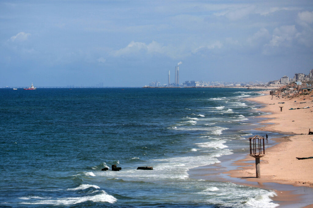 Israel's electricity power plant in Ashkelon on the Israel-Gaza border can be seen as the Open Arms maritime vessel that set sail from Larnaca in Cyprus carrying humanitarian aid approaches the coast of Gaza City on March 15, 2024. (AFP)