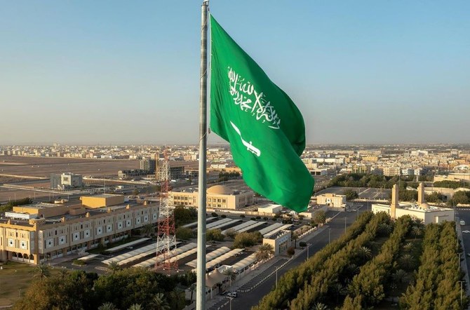 The green Saudi flag bears the “shahada,” the declaration of Muslim faith, inscribed above the sword. (SPA)