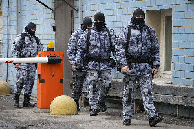 Police officers walk near the Basmanny District Court in Moscow in the days after a Daesh attack. (AP)