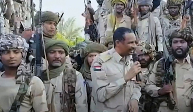 An image grab taken from a handout video posted on the Sudanese paramilitary Rapid Support Forces (RSF) page on Twitter, on July 28, 2023 shows its commander Mohamed Hamdan Daglo addressing RSF fighters at an undisclosed location. (AFP)