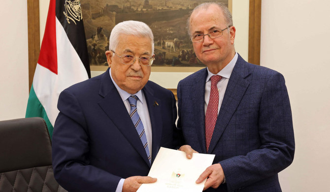 Palestine President Mahmoud Abbas issued a presidential decree on Thursday asking Mohammad Mustafa (right) to form a new Palestinian government. (AFP)