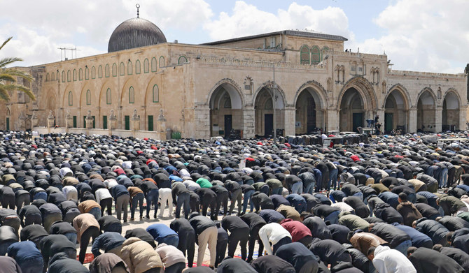 Palestinian Muslim devotees perform noon prayers on the second Friday of the Islamic holy fasting month of Ramadan in the Al-Aqsa mosque compound in the Old City of Jerusalem on March 22, 2024. (AFP)