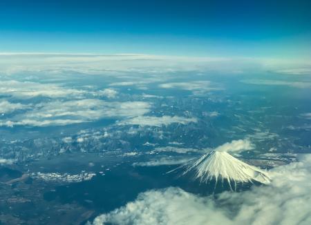 This aerial view of Mount Fuji, Japan's highest peak at 3,776 meters (12,388 feet), is seen from the window of a flight from Tokyo to Hong Kong, above Shizuoka Prefecture on March 1, 2024. (AFP)