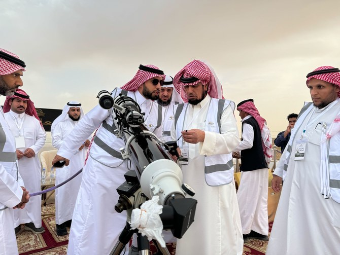 Observers at the Sudair Astronomical Observatory in Saudi Arabia check their equipment ahead of sunset when they will attempt to spot the Ramadan crescent moon. (AN photo)