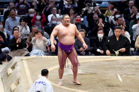 Sumo wrestler Takerufuji reacts after winning the 15-day Spring Grand Sumo Tournament at Edion Arena Osaka in Osaka on March 24, 2024. (AFP)