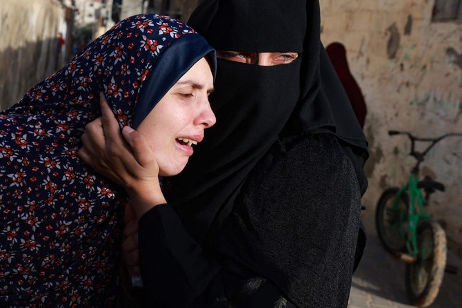 Rania Abu Anza (L) the mother of twin babies Naeem and Wissam, killed in an overnight Israeli air strike, mourns their death ahead of their burial in Rafah on March 3, 2024. (File/AFP)