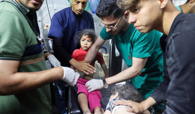 Children injured during Israeli bombardment receive treatment at at the Kuwait Hospital in Rafah, on the southern Gaza Strip on April 20, 2024, amid ongoing battles between Israel and the Palestinian militant group Hamas. (AFP)