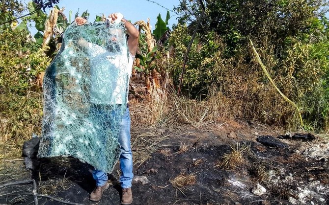 A man inspects the destroyed windshield of a vehicle that was hit by an Israeli strike in the Adloun plain area, between Lebanon’s southern cities of Sidon and Tyre, Apr. 23, 2024. (AFP)