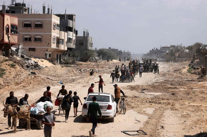 Palestinians who had taken refuge in Rafah in the Gaza Strip leave the city to return to Khan Yunis after Israel pulled its ground forces out of the southern Gaza Strip, on April 7, 2024. (AFP)