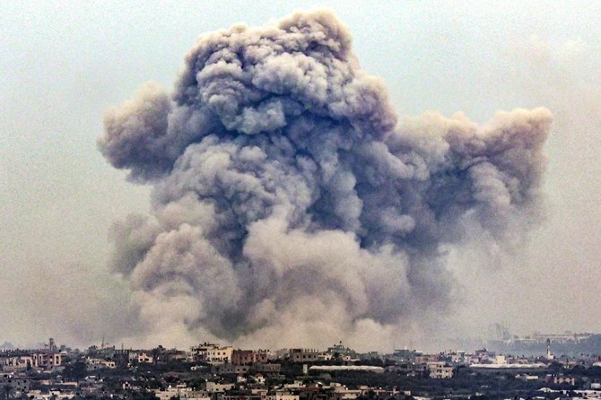 Smoke billows over Khan Yunis from Rafah in the southern Gaza strip during Israeli bombardment. (AFP/File)