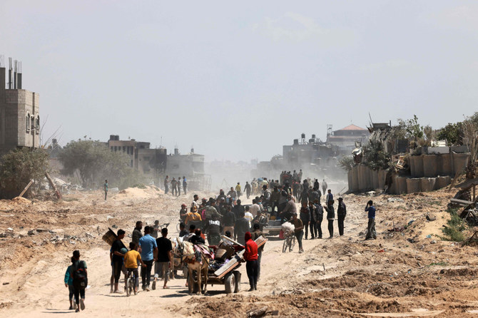 Israeli army vehicles move in an area along the border with the Gaza Strip and southern Israel on April 4, 2024. On Sunday, most of Israel's troops pulled out of Khan Younis in the southern Gaza Strip after six months of war. (AFP)