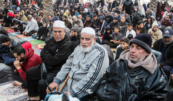 Palestinians attend Eid Al-Fitr prayers in the northern Gaza Strip on Wednesday amid the ongoing conflict between Israel and Hamas. (Reuters)