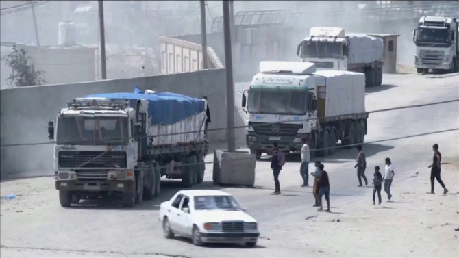 A convoy of aid trucks drives into Gaza from Rafah crossing, April 9, 2024, amid the ongoing conflict between Israel and the Palestinian Islamist group Hamas, in this screen grab taken from video. (Reuters)