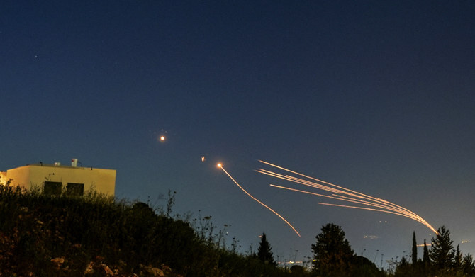 Israel's Iron Dome anti-missile system intercepts rockets launched from Lebanon towards Israel over the Israeli Lebanese border, as seen from northern Israel, April 12, 2024. (REUTERS)