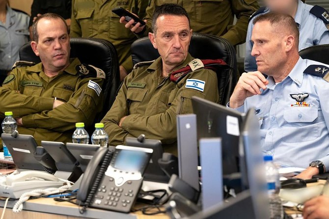 This handout picture released by the Israeli Army shows the head of the military, Lt. Gen. Herzi Halevi (C), attending early on April 14, 2024 a meeting at the Israeli Air Force Operations Center in Kirya in Tel Aviv with the commanding officers of the Israeli Air Force, the operations directorate and the intelligence directorate. The Israeli military said on April 14 that Iran’s attack using hundreds of drones and missiles had been “foiled,” with 99 percent of them intercepted overnight.(AFP)