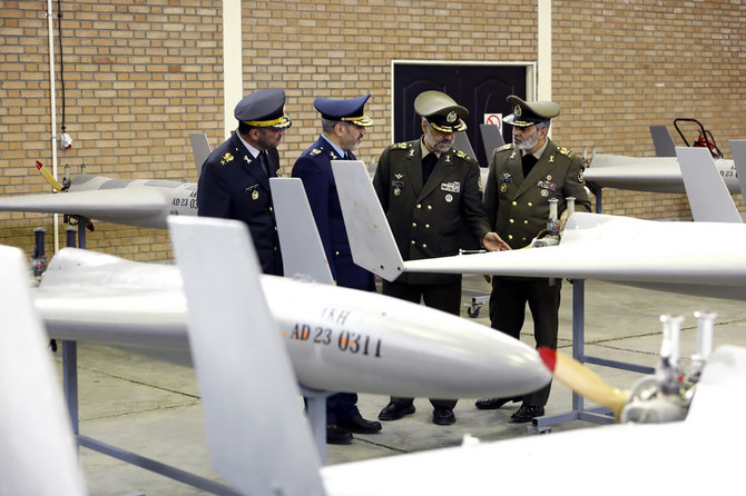 Iran Defense Minister Mohammad Reza Ashtiani (2nd-R) and military chief Major General Abdolrahim Mousavi (R) taking part in the unveiling ceremony of UAVs at an undisclosed location in Iran. (Iran Army handout/AFP)