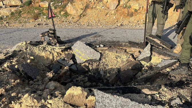 A view of a crater on a damaged road, after Iran's mass drone and missile attack, at a location given as Hermon area, Israel, in this handout picture released on April 14, 2024. Israel Defense Forces/Handout via REUTERS THIS IMAGE HAS BEEN SUPPLIED BY A THIRD PARTY