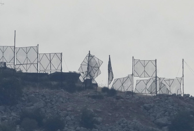 The fence of an Israeli military position is seen damaged after Hezbollah's rocket attacks, on an occupied hill of Kfar Chouba village, southeast Lebanon, Sunday, Oct. 8, 2023. (AP)