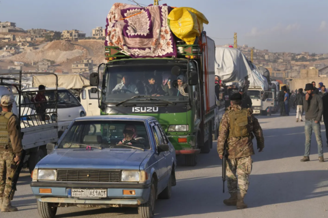 Syrian refugees return to their home country from the Lebanese border town of Arsal, Oct. 26, 2022. (AP Photo)