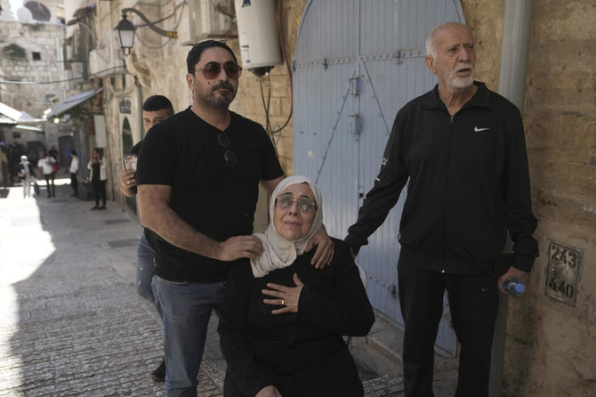 Nora Sub Laban is comforted by family as she reacts to their eviction from their home to make way for Israeli settlers in Jerusalem’s Old City, Tuesday, July 11, 2023. (AP)