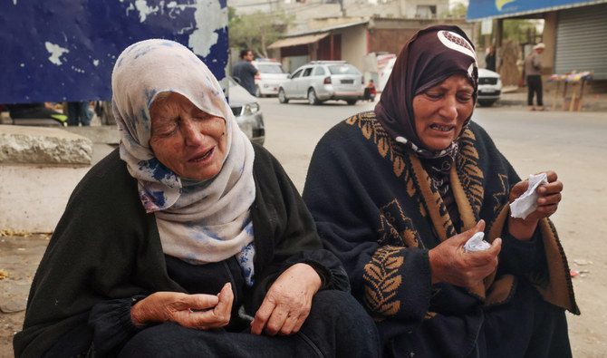 Palestinian women mourn the death of loved ones outside Al-Najjar hospital following overnight Israeli bombardment in Rafah in the southern Gaza Strip on April 18, 2024. (AFP)