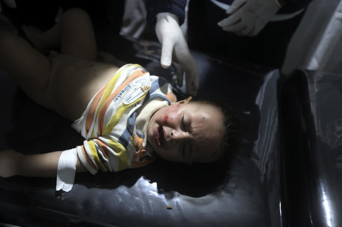 Palestinian medics treat a wounded child in the Israeli bombardment in Rafah late Friday, April 19, 2024. (AP)