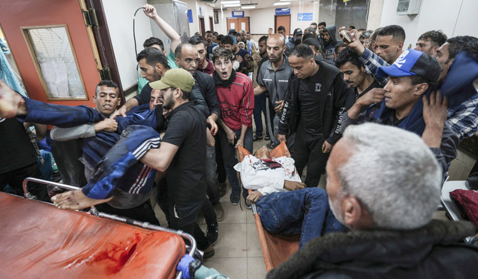 Wounded Palestinians arrive at the Al-Aqsa Hospital in Deir El-Balah in central Gaza. Several people were killed in an Israeli strike on the Maghazi camp. (AP file photo)