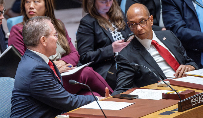 Israel's Ambassador to the United Nations Gilad Erdan shakse hands with Alternate Representative of the United States for Special Political Affairs in the United Nations Robert Wood during a Security Council meeting to address the situation in the Middle East, including the Palestinian question, at UN headquarters in New York City, New York, US, April 18, 2024. (REUTERS)