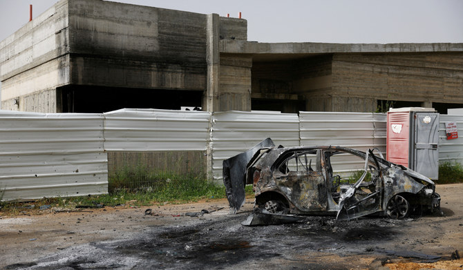 A destroyed vehicle stands outside a damaged community center, the day after Hezbollah launched missiles and drones at the Bedouin village of Arab al-Aramshe, amid ongoing cross-border hostilities between Hezbollah and Israel, in northern Israel April 18, 2024. (REUTERS)