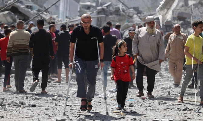 Palestinians inspect the debris after Israeli bombardment at Al-Daraj neighbourhood in Gaza City on April 22, 2024, amid ongoing battles between Israel and the Palestinian Hamas movement. (AFP)