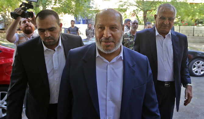 Hamas’s chief representative in Lebanon Osama Hamdan (L), Hamas Arab relations chief Khalil Al-Hayya (C), secretary general of the Popular Front for the Liberation of Palestine-General Command, Talal Naji, arrive for a press conference during a visit to the Syrian capital Damascus on October 19, 2022. (AFP file photo)