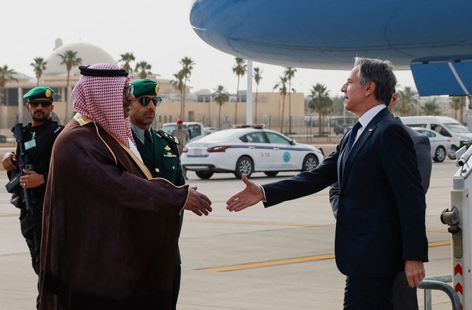 US Secretary of State Antony Blinken is welcomed by Saudi Ministry of Foreign Affairs Director of Protocol Affairs Mohammed Al-Ghamdi as he visits Saudi Arabia in the latest Gaza diplomacy push, in Riyadh on April 29, 2024. (AFP)