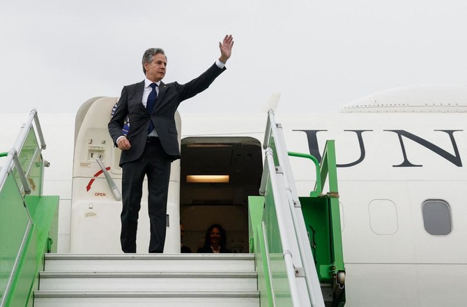 US Secretary of State Antony Blinken waves while boarding a plane as he departs for Jordan in the latest Gaza diplomacy push, in the Saudi captial Riyadh. (AFP)