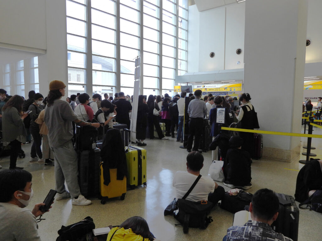 People crowd due to tsunami warning at Naha Airport in Naha, Okinawa prefecture. (AFP)