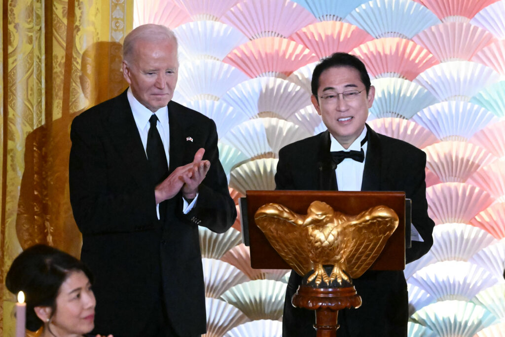 US President Joe Biden applauds as Japanese Prime Minister KISHIDA Fumio speaks during a State Dinner in the East Room of the White House in Washington, DC, April 10, 2024. (AFP)