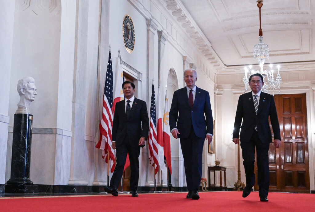 US President Joe Biden heads to a trilateral meeting with Japanese Prime Minister KISHIDA Fumio (R) and Filipino President Ferdinand Marcos Jr. (L) at the White House in Washington, DC, on April 11, 2024. (AFP)