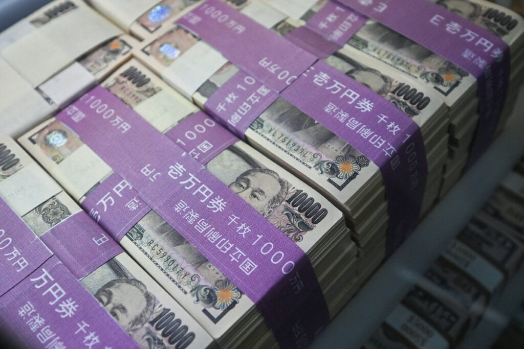 This general view shows 10,000 yen notes (65 USD) on display in the window of a currency exchange shop in central Tokyo on April 17, 2024. (AFP)