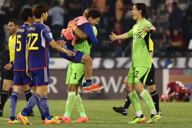 Japan's players celebrate after winning the U23 AFC Qatar 2024 Asian Cup quarterfinal against Qatar at Jassim Bin Hamad Stadium in Doha on April 25, 2024. (AFP)