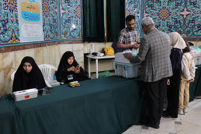 A man votes during the runoff parliamentary elections in Tehran, Iran on May 10, 2024. (West Asia News Agency via Reuters)