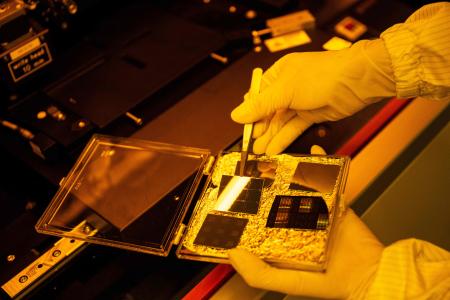 This picture taken on May 1, 2024 shows Tokyo University PhD student Kei Misumi working in a clean room at Tokyo University in Tokyo. (AFP)