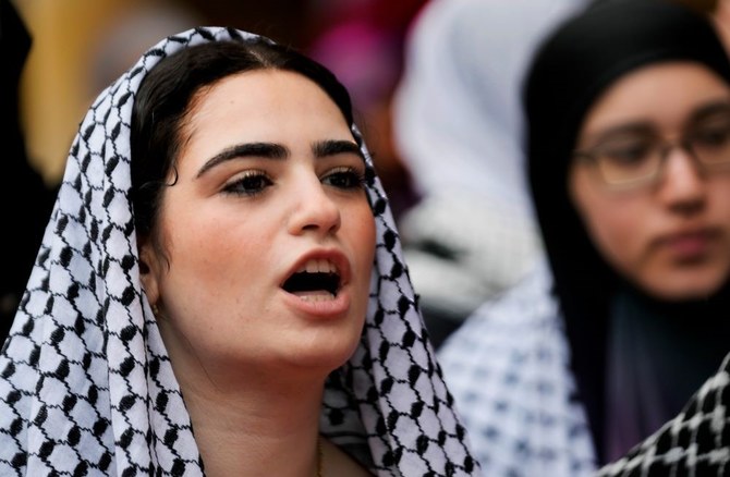 A Lebanese student, wearing a Palestinian headscarf, or keffiyeh, demonstrates at the American University of Beirut in a show of solidarity with Gaza, Beirut, Tuesday, April 30, 2024. (AP Photo)