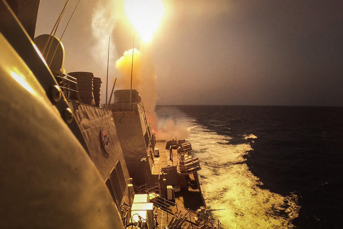 The Arleigh Burke-class guided-missile destroyer USS Carney (DDG 64) defeats a combination of Houthi missiles and unmanned aerial vehicles in the Red Sea. (File/AFP)