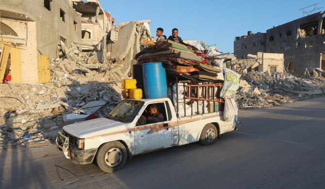 Displaced Palestinians, who fled Rafah after the Israeli military began evacuating civilians from the eastern parts of the southern Gazan city, ahead of a threatened assault, amid the ongoing conflict between Israel and Hamas, travel on a vehicle, in Khan Younis in the southern Gaza Strip May 6, 2024. (REUTERS)