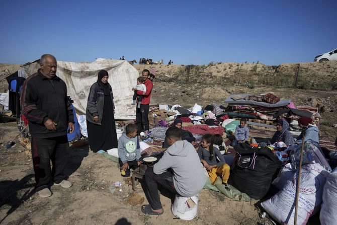 Displaced Palestinians arrive in central Gaza after fleeing from the southern Gaza city of Rafah in Deir al Balah, Gaza Strip, on May 7, 2024. (AP)