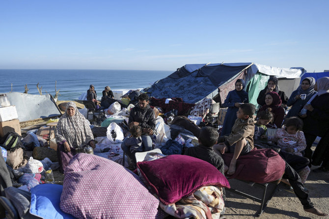 Displaced Palestinians arrive in central Gaza after fleeing from the southern Gaza city of Rafah in Deir al Balah, Gaza Strip, on May 7, 2024. (AP)