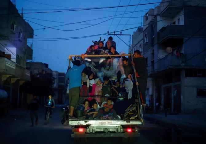 Palestinians ride on a vehicle as they flee Rafah after Israeli forces launched a ground and air operation in the eastern part of the southern Gaza City, amid the ongoing conflict between Israel and Hamas, in Rafah. (Reuters)