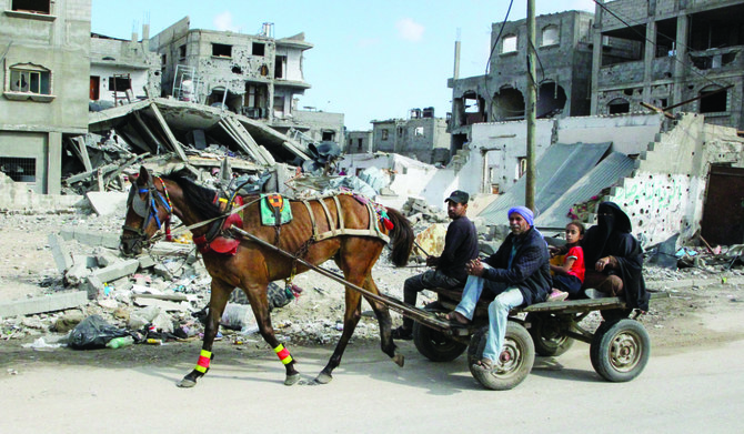 Displaced Palestinians flee Rafah on Sunday after Israeli forces launched a ground and air offensive in the eastern part of the southern Gaza city. (Reuters)