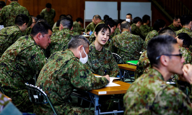 Japan Ground Self-Defense Force (JGSDF) soldiers participate in a seminar to prevent harassment at JGSDF Camp Asaka, in Tokyo, Japan April 16, 2024. (Reuters)