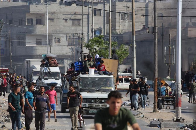 Retired Indian army officer Waibhav Anil Kale was killed and a colleague was injured in an unidentified strike on a UN car in Rafah. Above, Palestinians flee Rafah toward a safer area on May 12, 2024. (AFP)